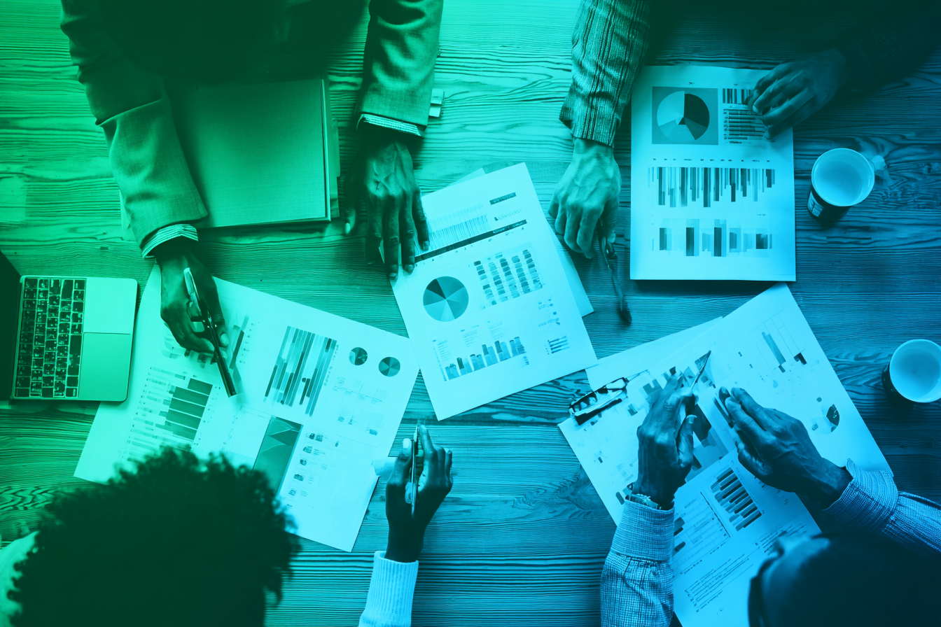 burnerai_Professionals_across_a_table_reviewing_documents_wit_ee706da9-b8bd-45ea-9a10-1fcb6be80a63_3