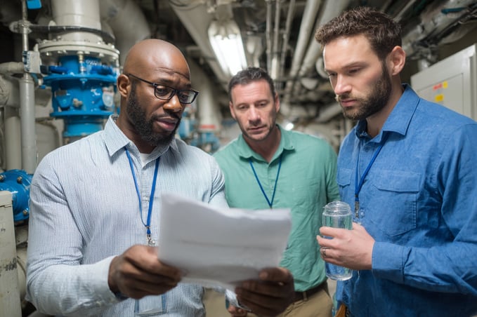 burnerai_Show_a_facility_manager_looking_at_a_high_utility_bi_325b26b5-2660-48b1-8df6-a893805d169a_3